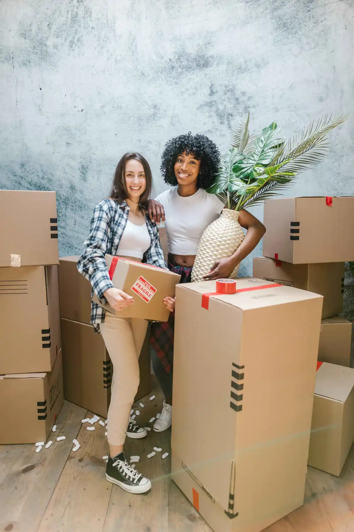 Two women packing up to move to Albuquerque, NM